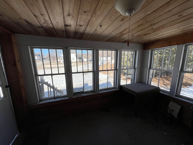 unfurnished sunroom with wood ceiling