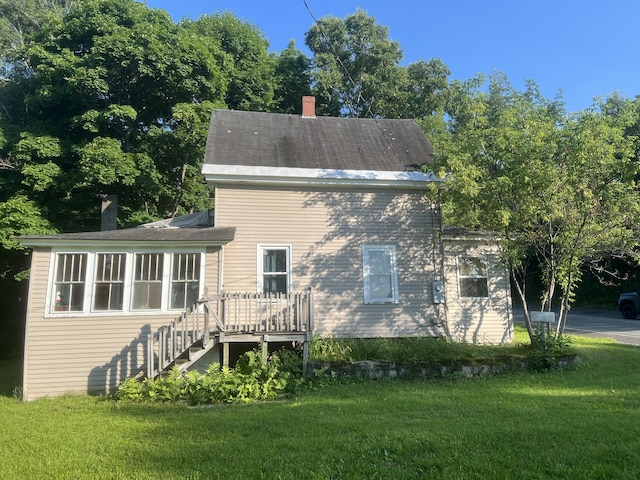 view of home's exterior with a yard