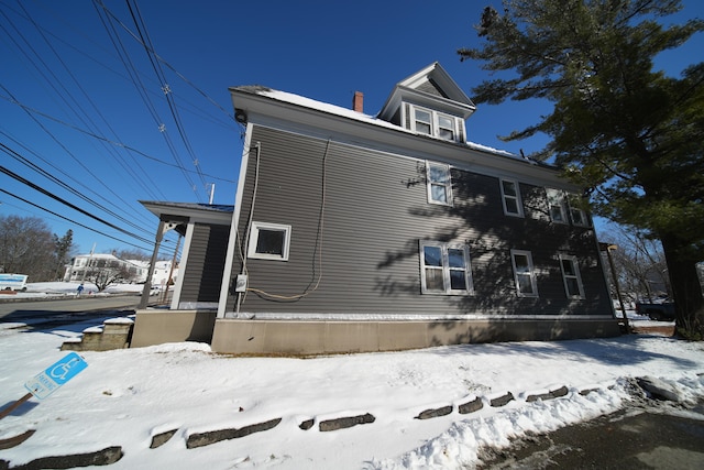 view of snow covered property