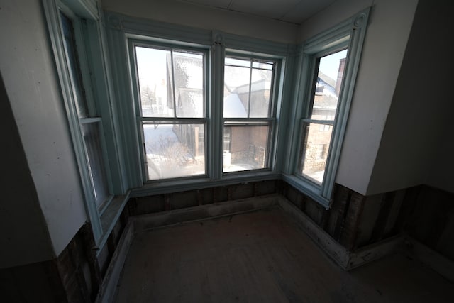 unfurnished sunroom featuring plenty of natural light