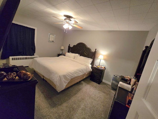 bedroom with ceiling fan, carpet flooring, and radiator