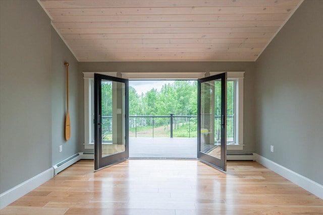 862 W Neck Rd, Nobleboro, ME 04555 - unfurnished room with vaulted ceiling, a baseboard radiator, wood ceiling, and light wood-style floors