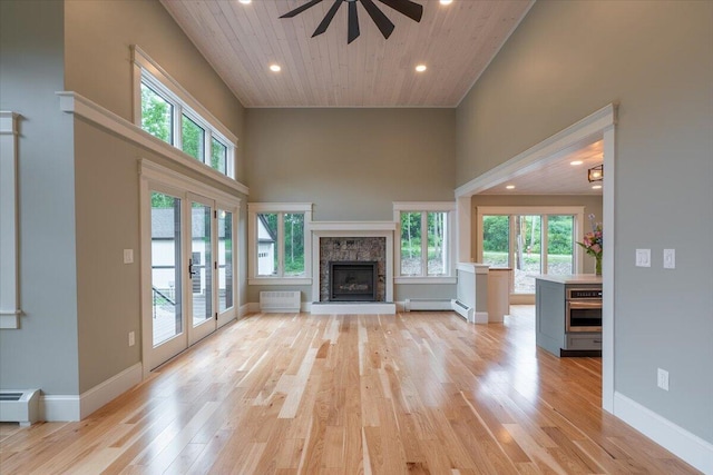 862 W Neck Rd, Nobleboro, ME 04555 - unfurnished living room with a towering ceiling, ceiling fan, light wood-type flooring, healthy amount of natural light, and recessed lighting