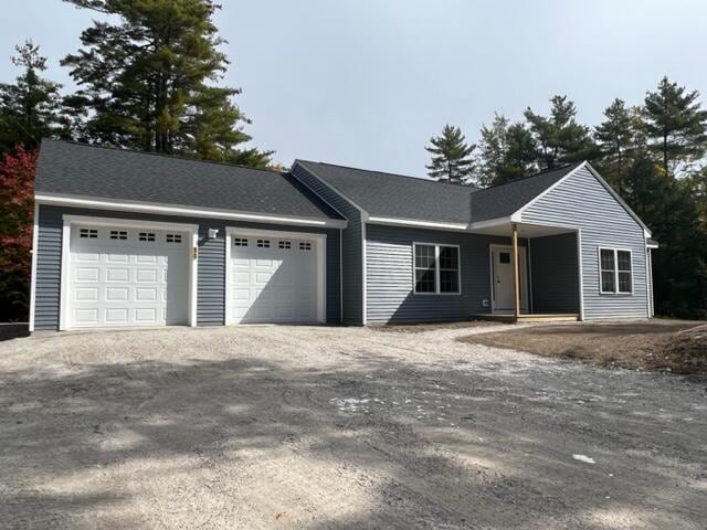 single story home featuring a garage