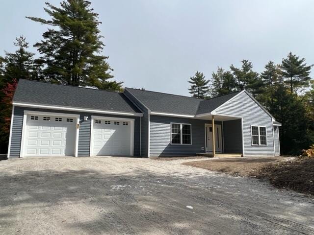 single story home with a garage