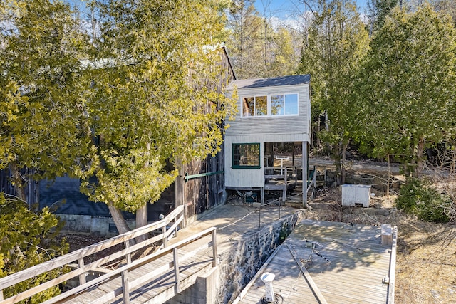 back of house featuring a deck