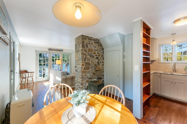 dining area featuring sink, dark wood-type flooring, and french doors