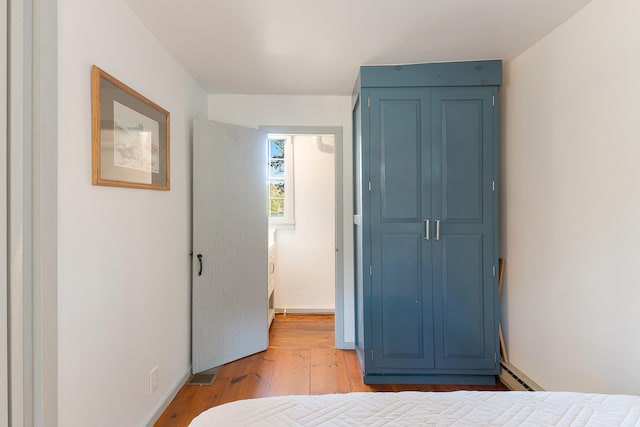 bedroom with light hardwood / wood-style flooring