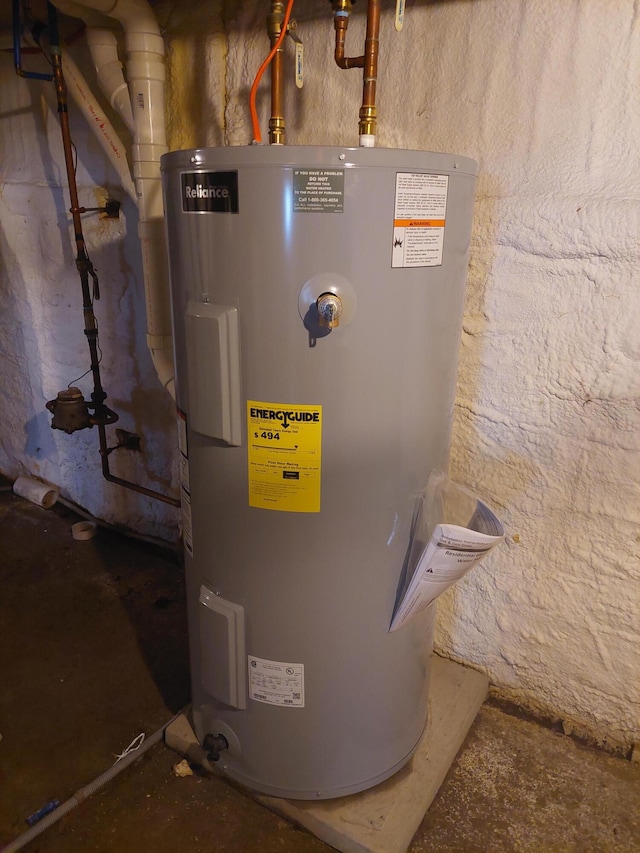 utility room featuring electric water heater