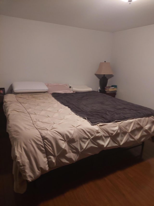 bedroom featuring hardwood / wood-style flooring