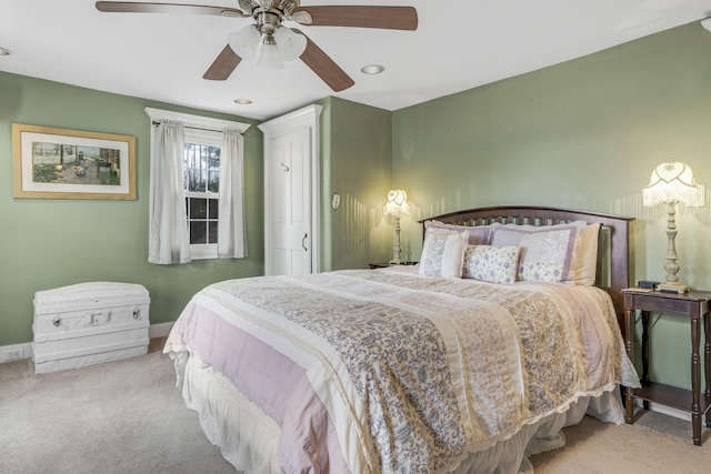 bedroom featuring light carpet and ceiling fan