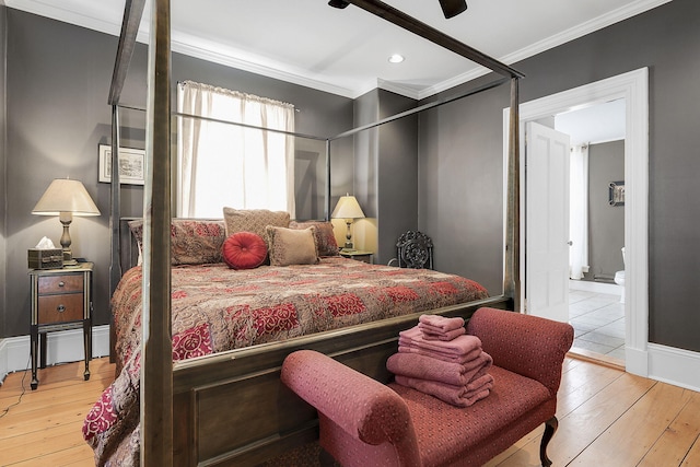 bedroom with wood-type flooring, ceiling fan, crown molding, and connected bathroom