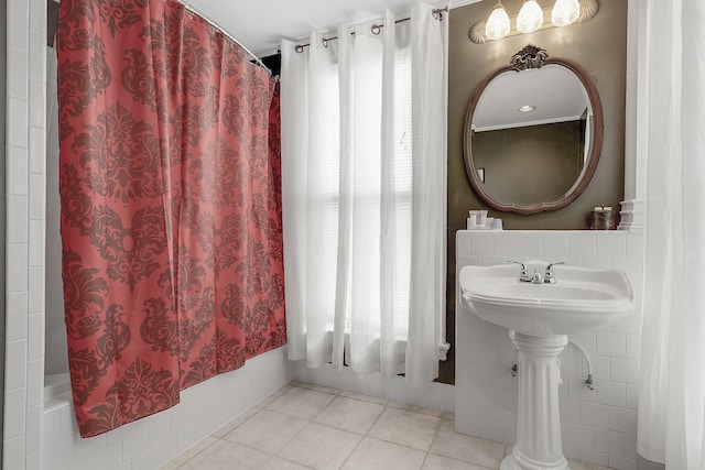 bathroom featuring curtained shower and tile patterned floors