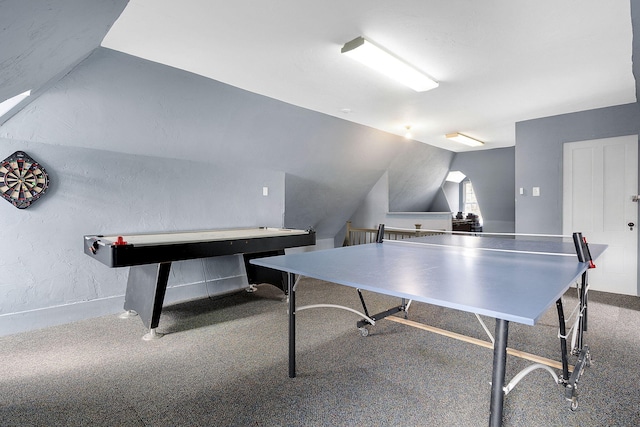 game room featuring carpet and vaulted ceiling