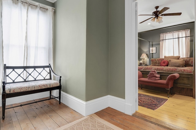 bedroom with multiple windows and light hardwood / wood-style floors