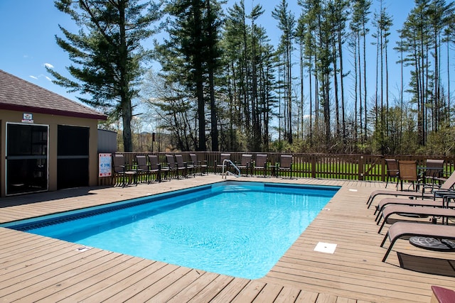 view of swimming pool with a wooden deck