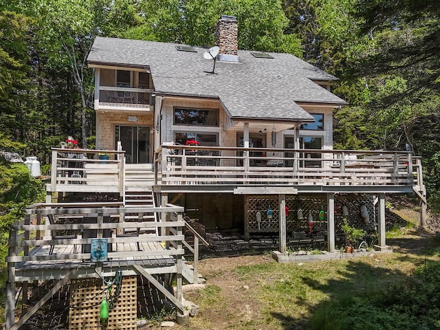 rear view of property with a deck