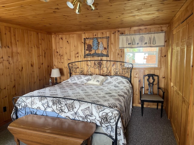 161 Burnt Lndg Unit T16 R5, Wels, ME 04779 - carpeted bedroom with wooden walls and wooden ceiling