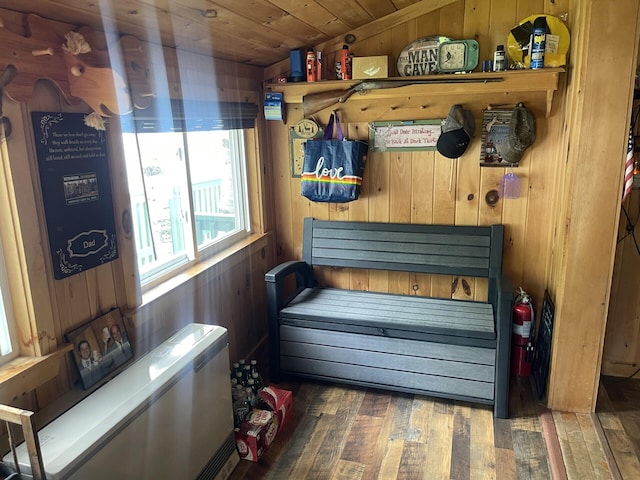161 Burnt Lndg Unit T16 R5, Wels, ME 04779 - mudroom featuring lofted ceiling, dark wood-type flooring, wood ceiling, and wooden walls