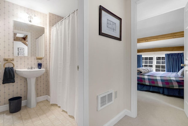 bathroom with tile flooring