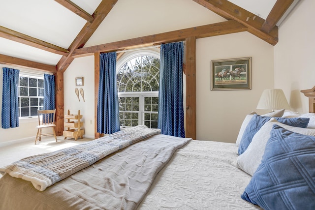 bedroom featuring vaulted ceiling with beams and carpet