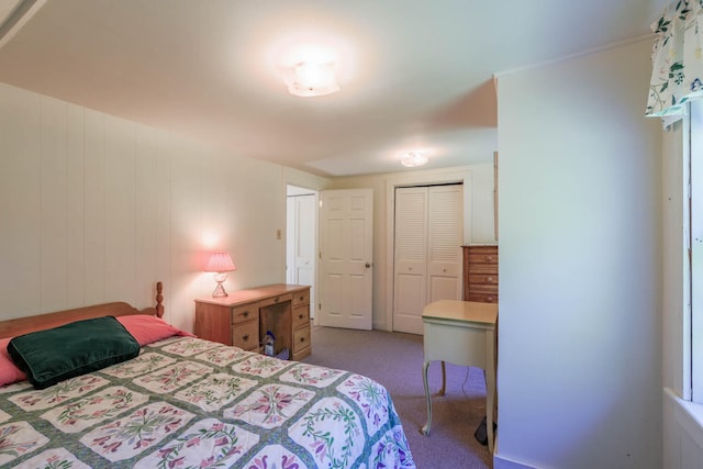 bedroom with light carpet and a closet