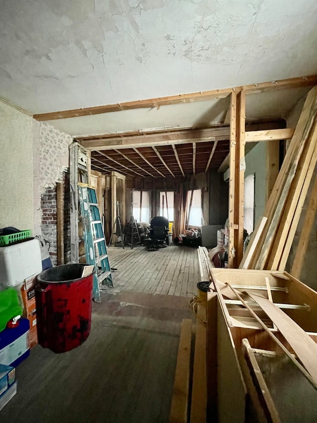 miscellaneous room featuring dark wood-type flooring