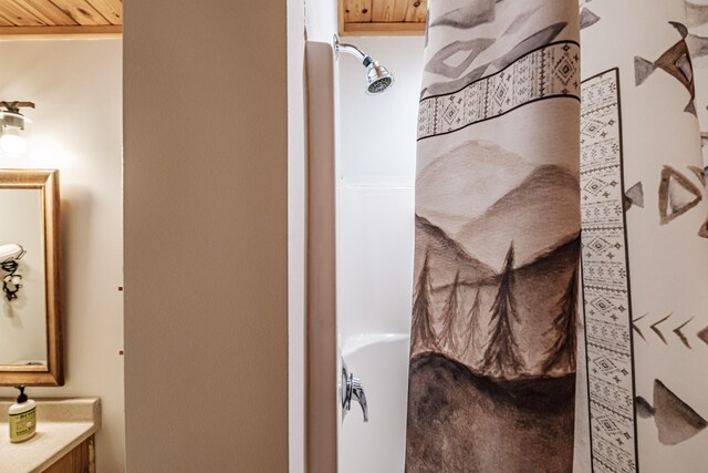 full bathroom with a shower, vanity, and a tub