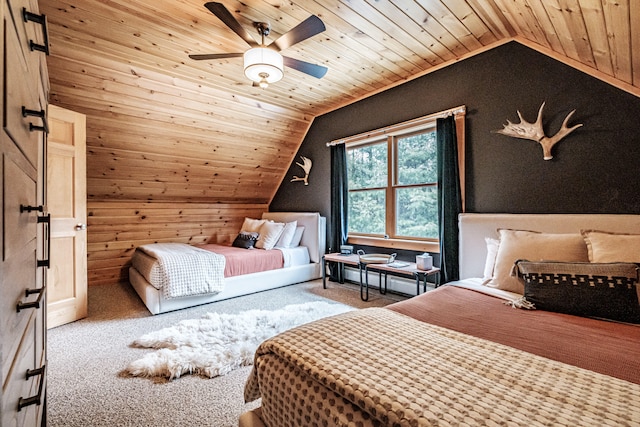 carpeted bedroom with a baseboard heating unit, vaulted ceiling, and wooden ceiling