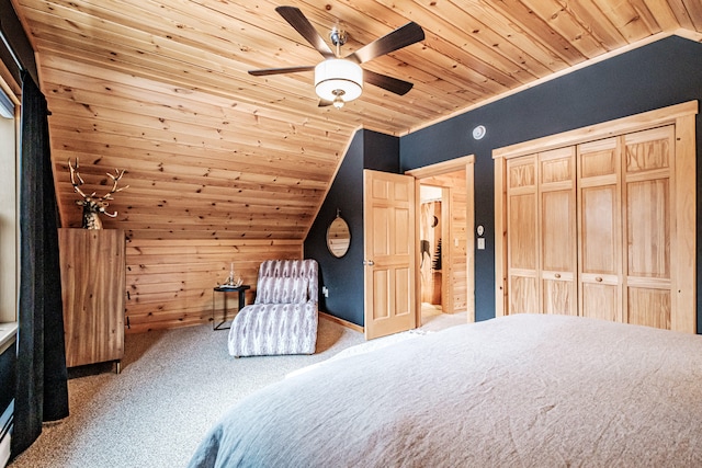 unfurnished bedroom featuring lofted ceiling, wood walls, carpet, and wooden ceiling