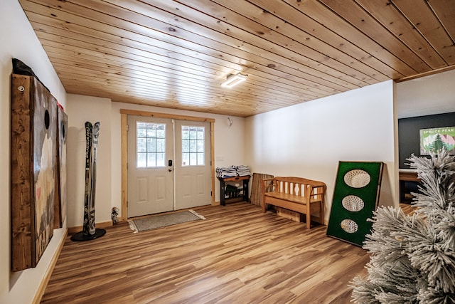 entryway with wooden ceiling, baseboards, light wood-style flooring, and french doors