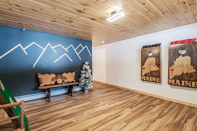 interior space featuring wood ceiling, baseboards, and wood finished floors