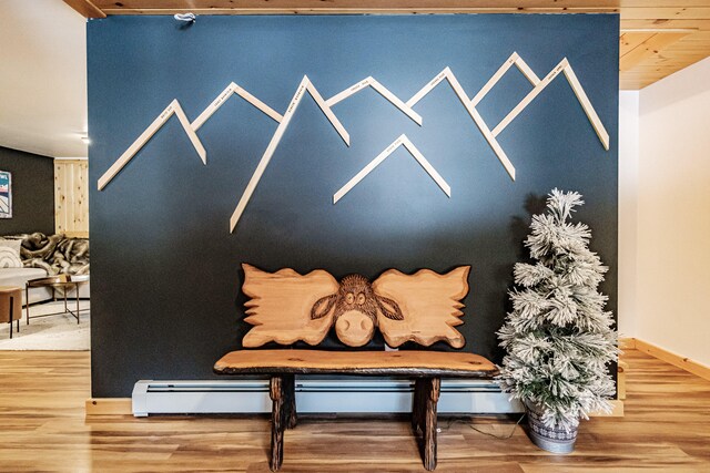 room details featuring baseboards and wood finished floors