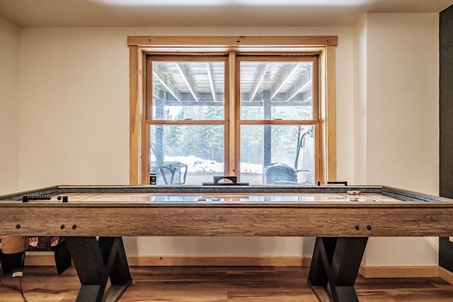 recreation room with plenty of natural light, baseboards, and wood finished floors