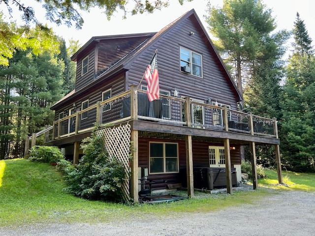 rear view of house with a lawn