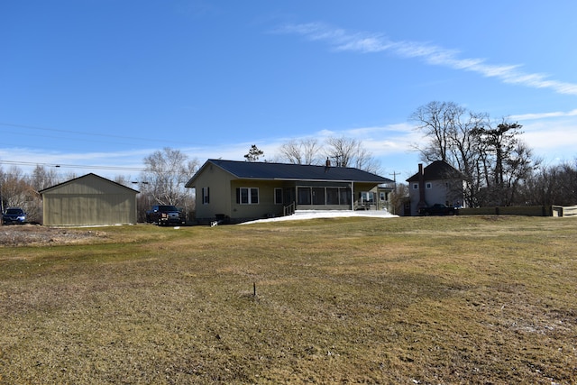 rear view of house with a yard