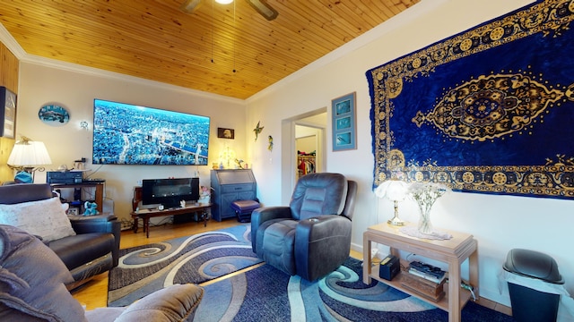 living room featuring light hardwood / wood-style floors, ornamental molding, wooden ceiling, and ceiling fan