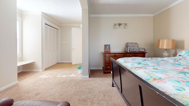 bedroom featuring light colored carpet, ornamental molding, and a closet