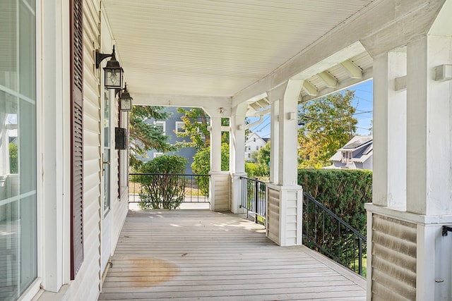 wooden terrace featuring a porch