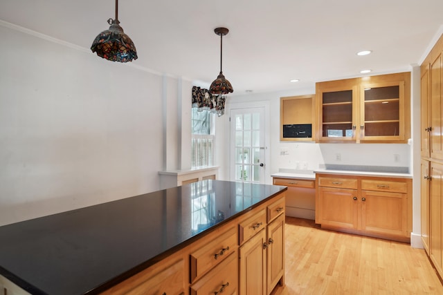 kitchen featuring pendant lighting, a notable chandelier, crown molding, and light hardwood / wood-style floors