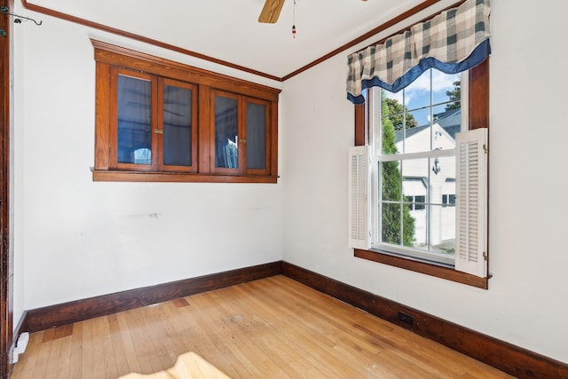 spare room with ceiling fan, light hardwood / wood-style flooring, and crown molding