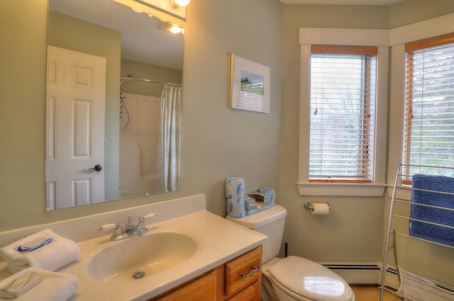 bathroom with toilet, vanity, a healthy amount of sunlight, and a shower with shower curtain