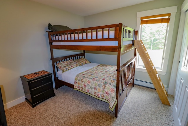 bedroom featuring baseboard heating and light colored carpet