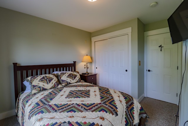 carpeted bedroom with a closet