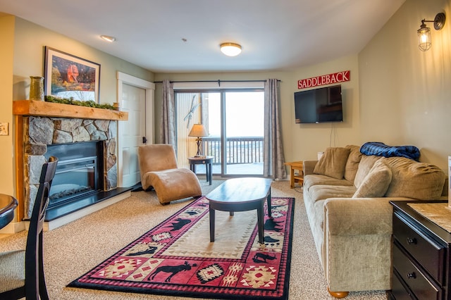 living room featuring a fireplace and carpet flooring