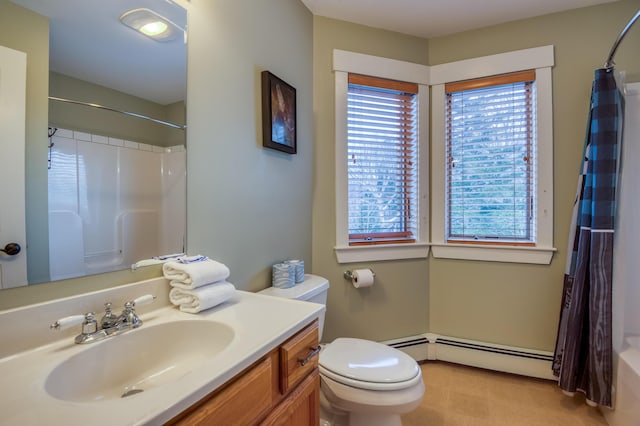 bathroom featuring a baseboard radiator, toilet, and vanity