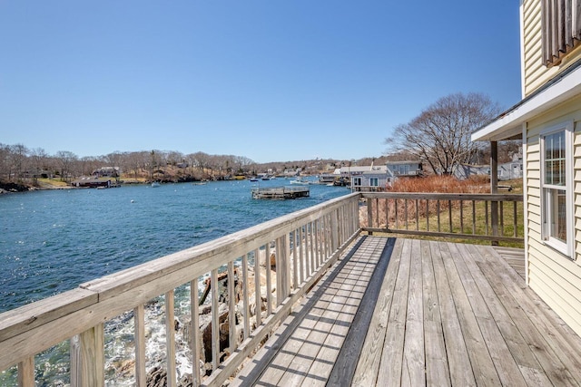 wooden deck with a water view