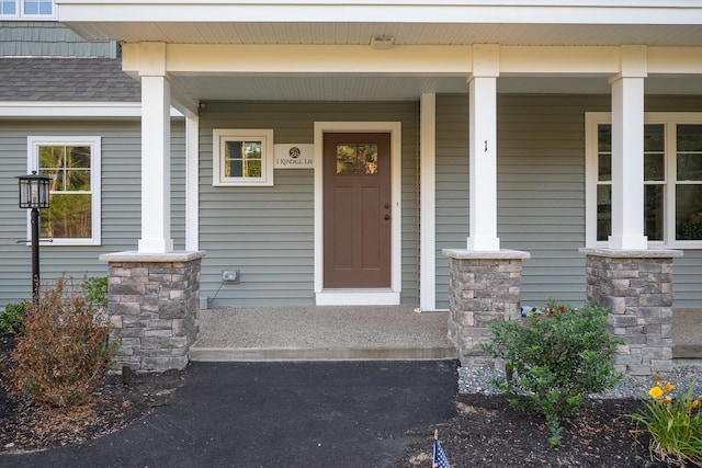 doorway to property featuring a porch