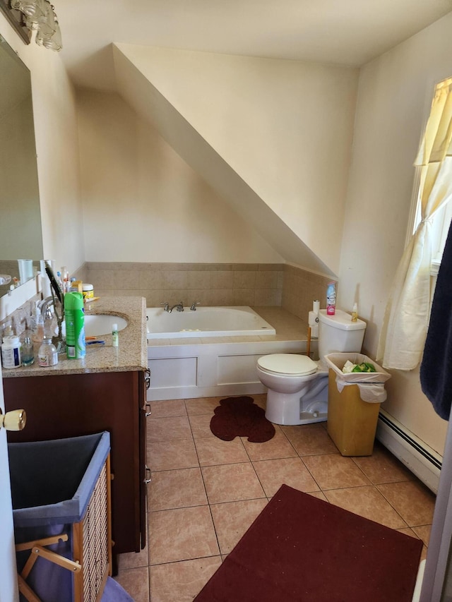 bathroom with toilet, vanity, tile patterned floors, baseboard heating, and a washtub