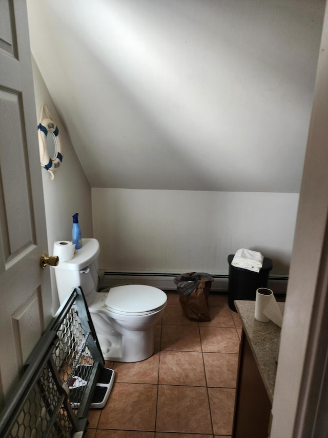 bathroom featuring baseboard heating, tile patterned floors, lofted ceiling, and toilet